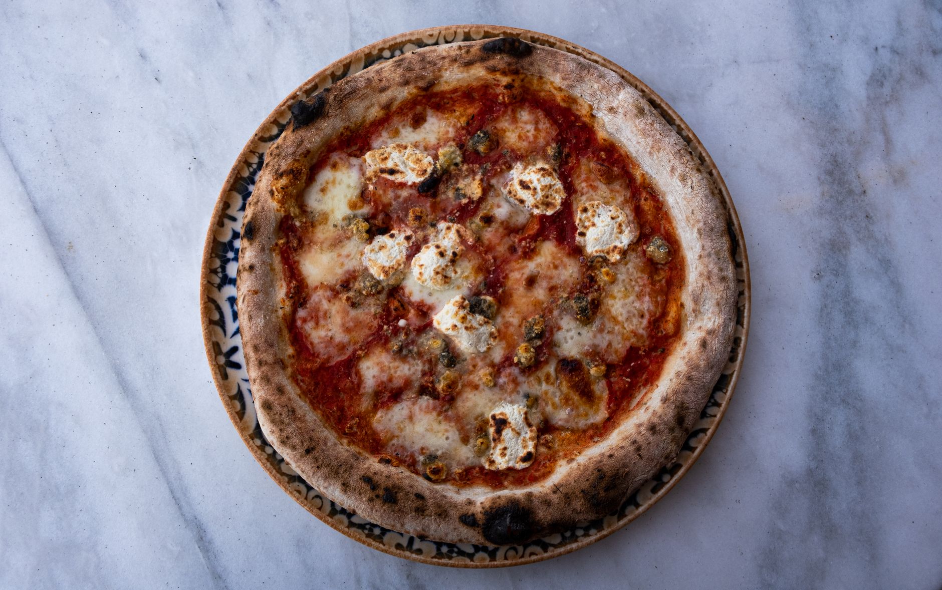 Wood-fired Neapolitan margherita pizza with mozzarella and tomato sauce