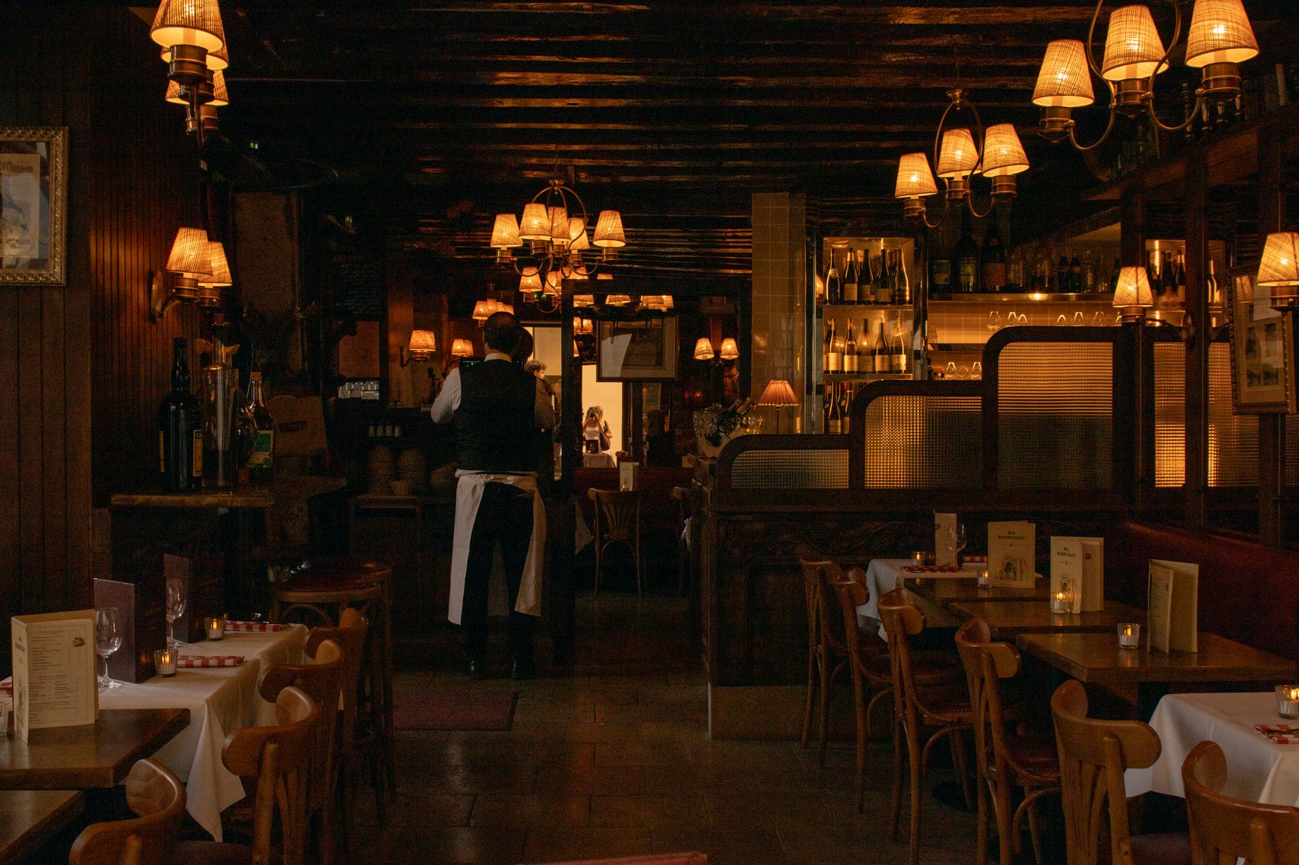 Cozy, dimly lit restaurant dining room interior